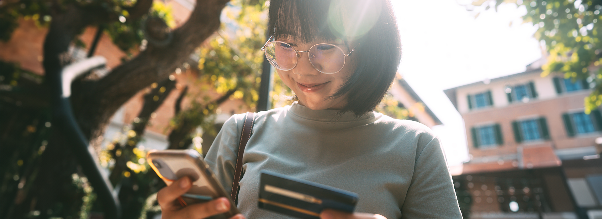 Woman making a payment on her mobile device